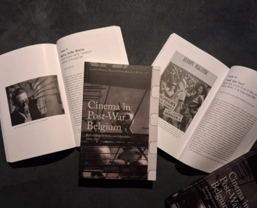 1 closed copy of book together with two open copies